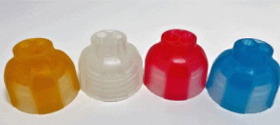 Two-shot plastic injection molded caps